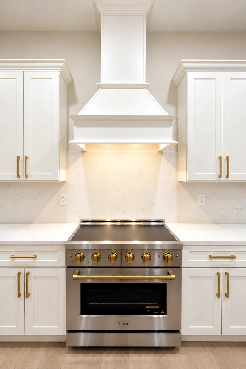 Saloli — White kitchen with brass accents